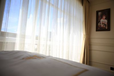 Close-up of curtain on window at home