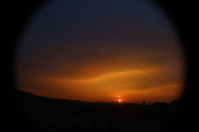 Scenic view of silhouette landscape against sky during sunset