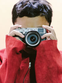 Portrait of woman photographing