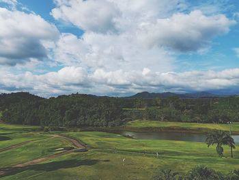 Scenic view of agricultural field against sky