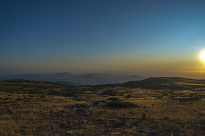 Scenic view of landscape against sky during sunset