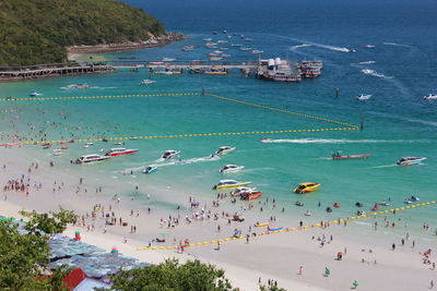 High angle view of people enjoying at beach