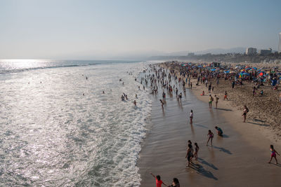 High angle view of people on beach against sky