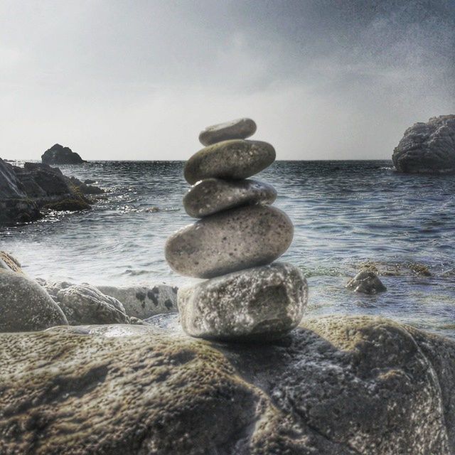 sea, horizon over water, water, rock - object, beach, sky, tranquility, tranquil scene, scenics, shore, balance, beauty in nature, nature, stack, stone - object, rock formation, idyllic, pebble, rock, stone