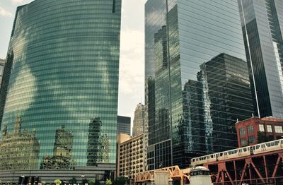 Low angle view of modern buildings against sky