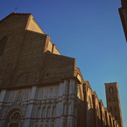 Low angle view of building against clear blue sky