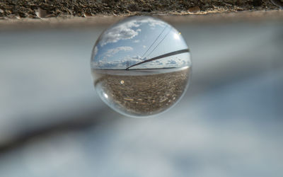 Close-up of crystal ball on land