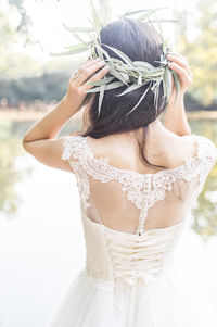 Rear view of woman wearing white dress