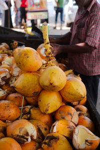 Coconuts for sale. the vendor will cut one open for you to start drinking from immediately.