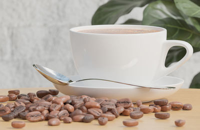 Close-up of coffee cup on table