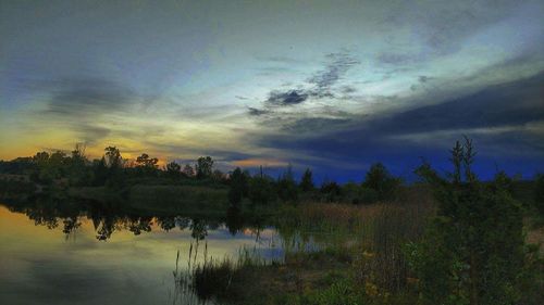 Scenic view of lake against sky during sunset
