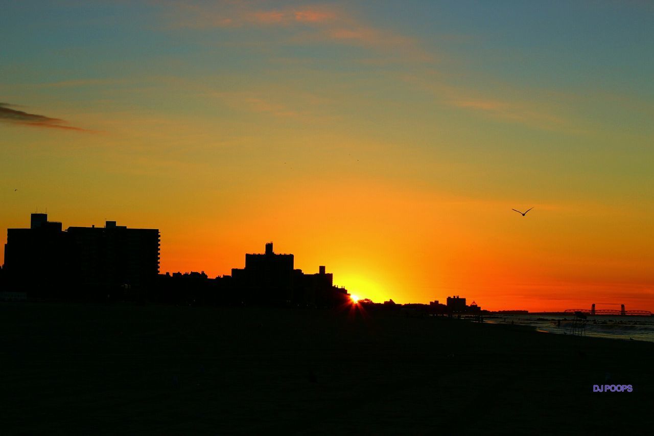 SILHOUETTE OF BUILDINGS AT SUNSET