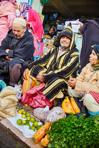 People at market stall