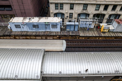 High angle view of train against buildings in city