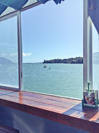 Scenic view of sea seen through window