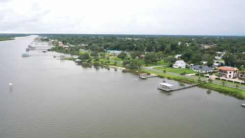 High angle view of river amidst buildings in city