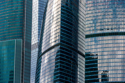 Glass ivory towers. the facade of downtown skyscrapers gleams in the sun.