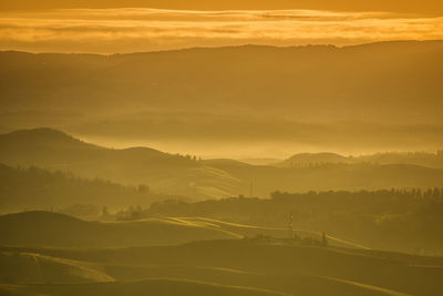 Scenic view of mountains against sky during sunset