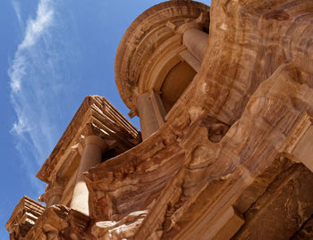 Photo taken at an oblique angle of a section of al-deir in the necropolis of petra