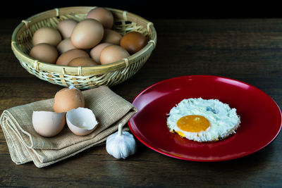 Close-up of eggs in basket on table