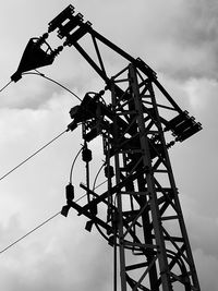 Low angle view of crane against sky