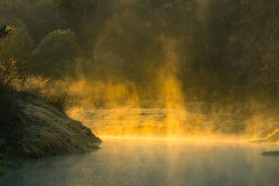 A beautiful spring river landscape with morning fog.