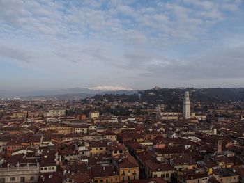 High angle view of cityscape against cloudy sky