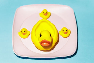 High angle view of yellow toys on table