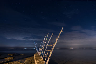 Scenic view of sea against sky at night