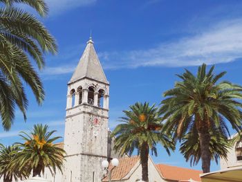 Low angle view of bell tower against sky