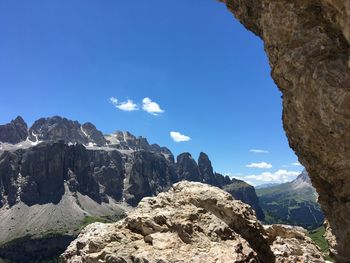 Scenic view of mountain against blue sky