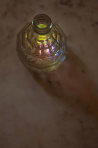 High angle view of illuminated lamp on table