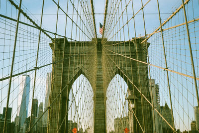 Low angle view of brooklyn bridge against sky