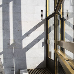 Shadows in a bright interior with marble walls on a bright sunny day. 