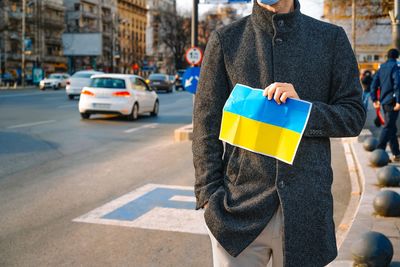 Protestor at anti-war rally holding banner. manifestation for peace in ukraine