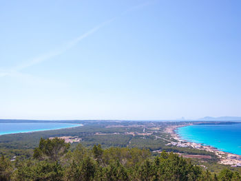 Scenic view of sea against blue sky