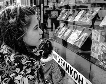 Side view of young woman looking away