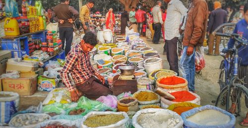 Man selling spices at market 