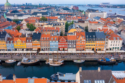 Famous nyhavn pier with colorful buildings and boats in copenhagen, denmark.