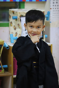 Portrait of boy standing at school