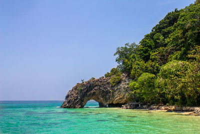 Scenic view of sea against clear blue sky