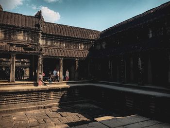 People in front of historical building