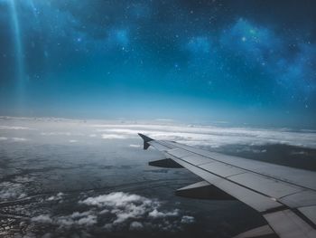 Airplane flying in sky at night