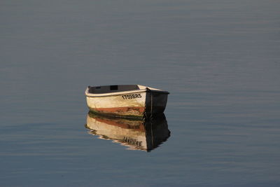 Boat on water against sky