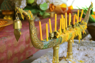 Close-up of bell hanging on metal in temple