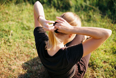 Midsection of woman on field