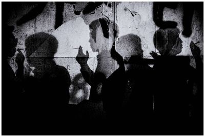 Shadow of people on wall
