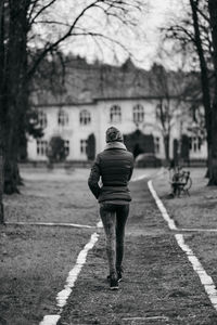 Rear view of man walking on street