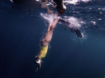 Freediving model taking a dip