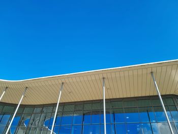 Low angle view of building against clear blue sky